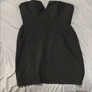 Strapless black dress with pockets